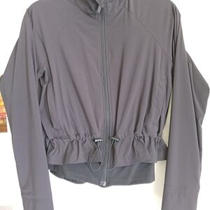 Women's XS FLX Black Workout Jacket With Cinched Waste And Thumb Holes.
